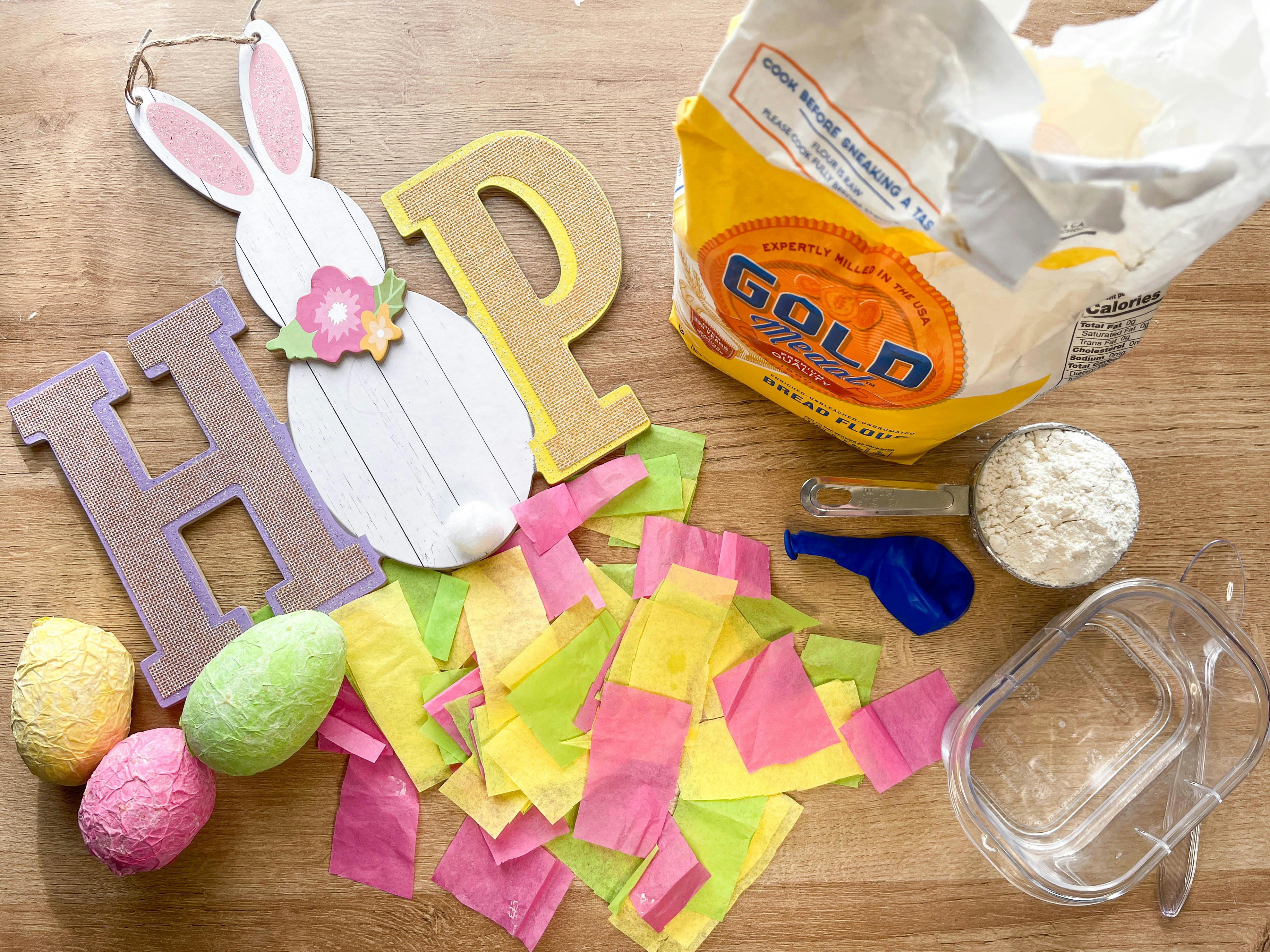 items to make paper mache easter eggs in front of easter decor 