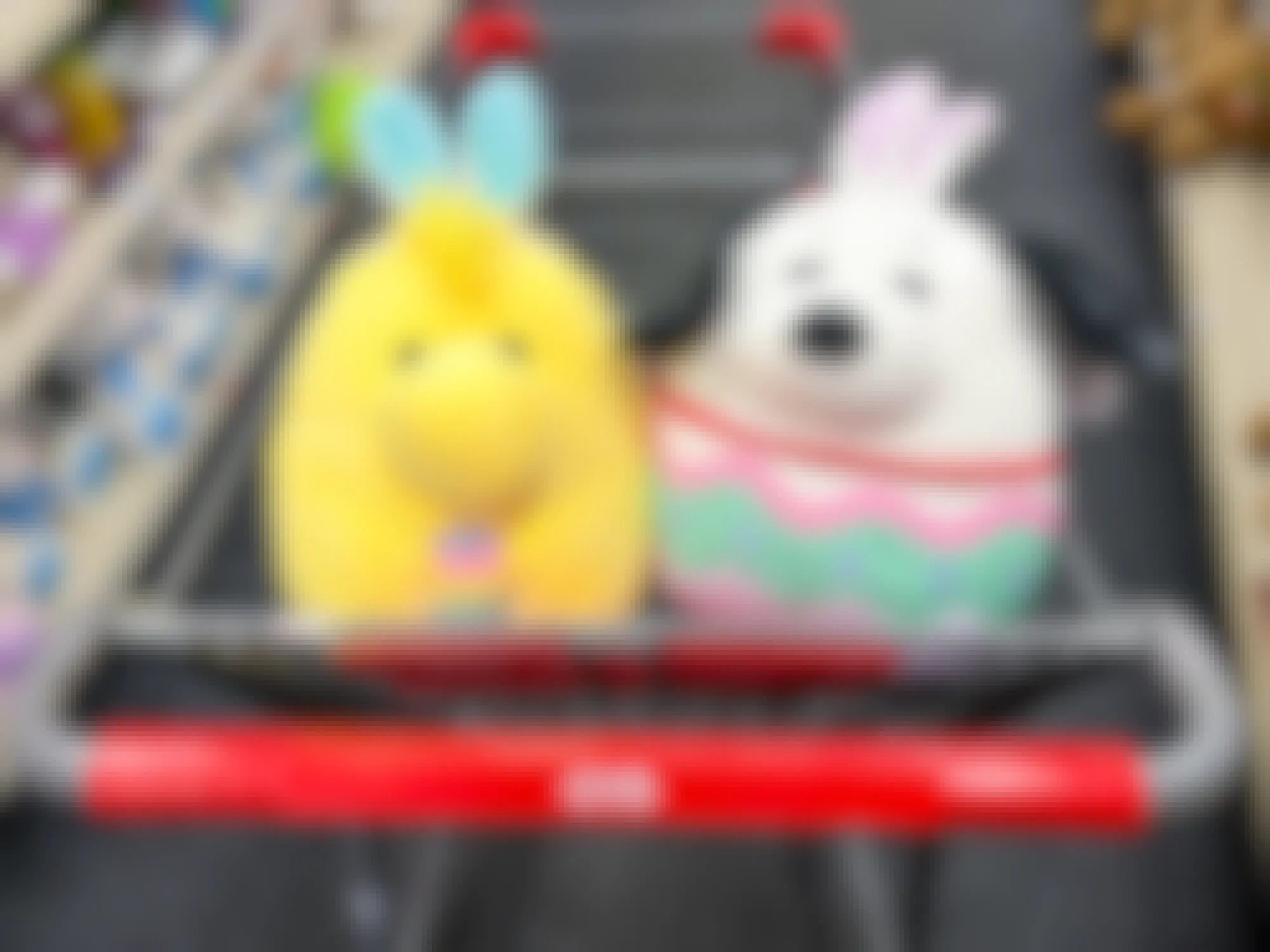 A Woodstock and Snoopy Easter Squishmallow sitting together in a CVS cart