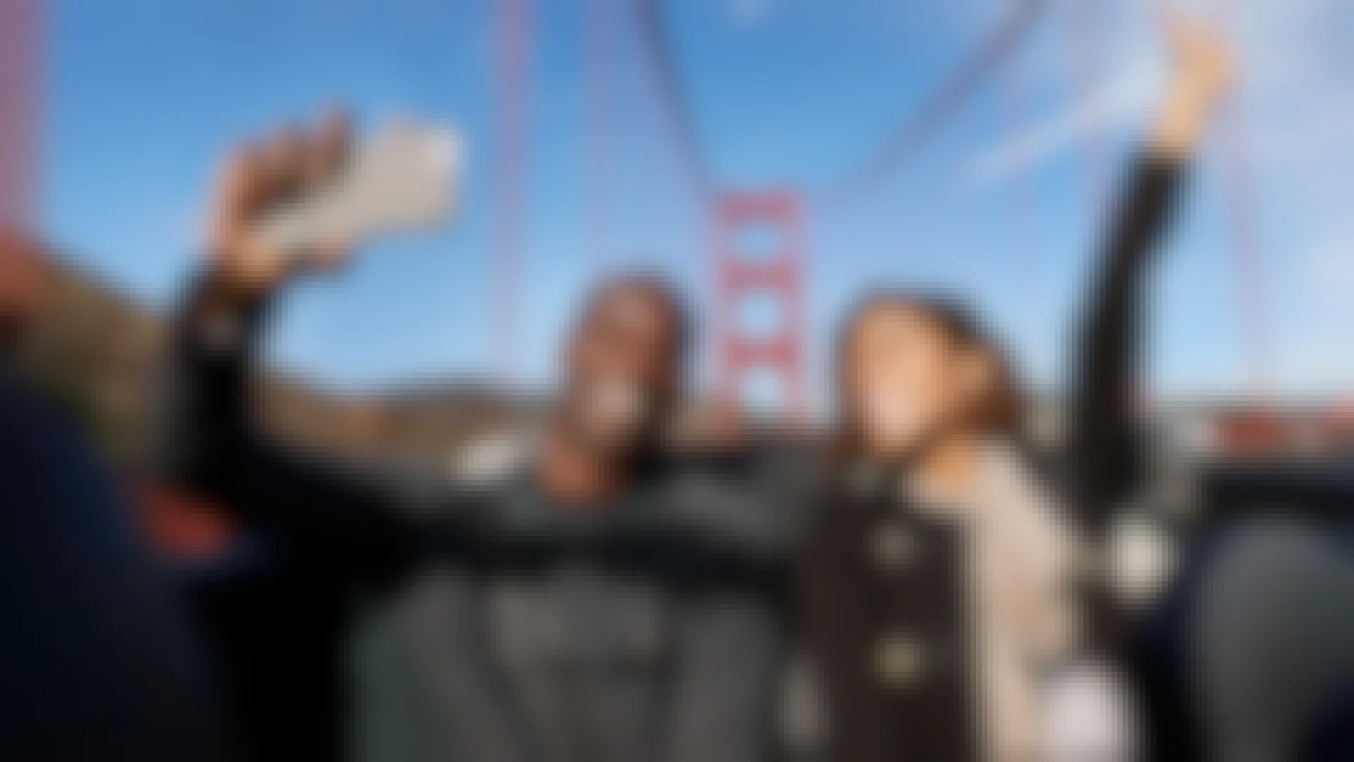 Couple takes a selfie on the Golden Gate Bridge