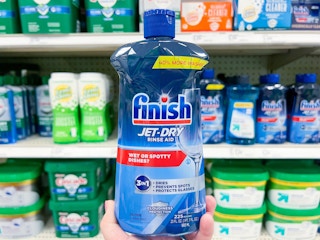 hand holding up bottle of Jet Dry rinse aid at Target in the aisle