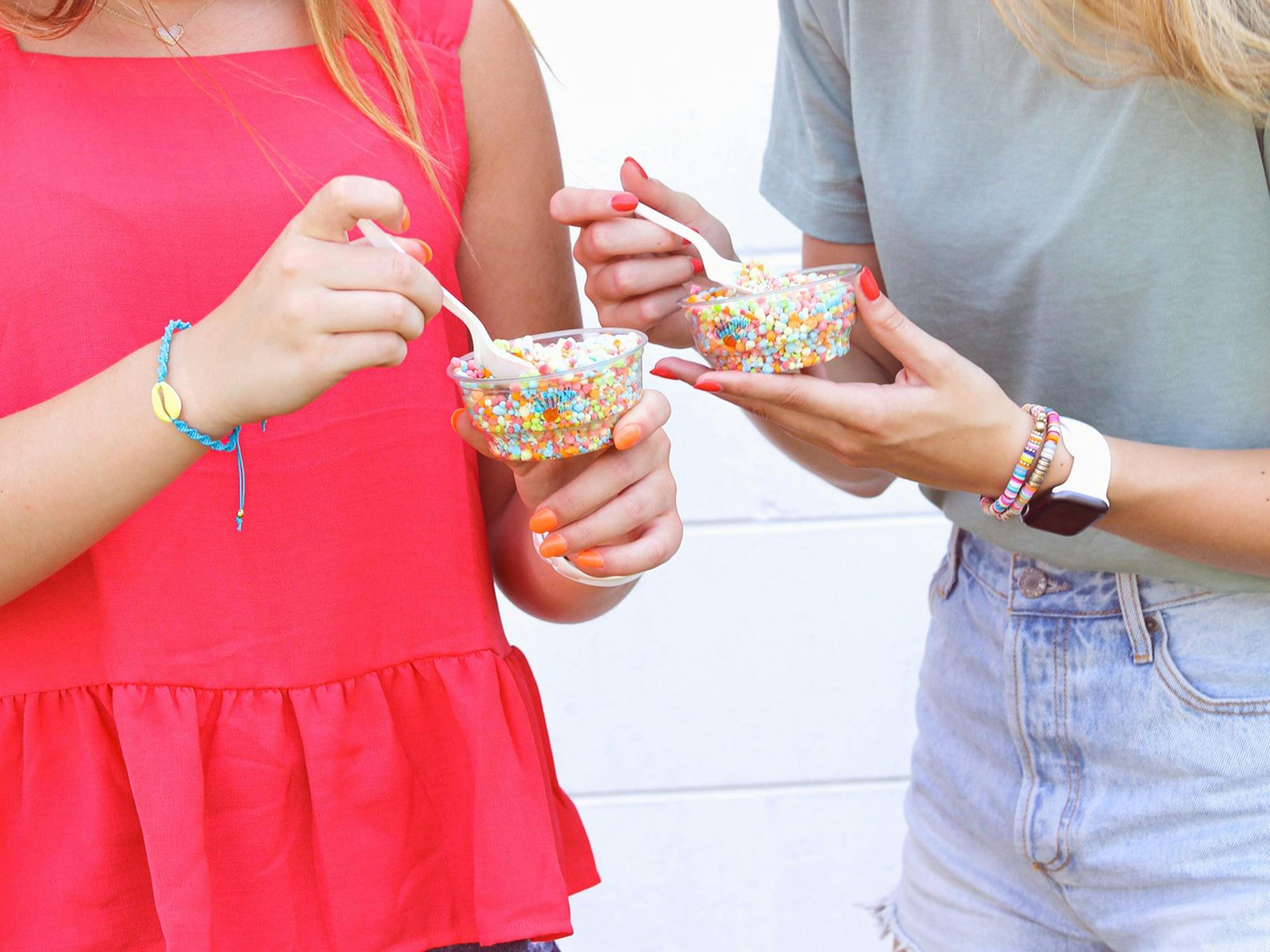 two people holding dippin' dots