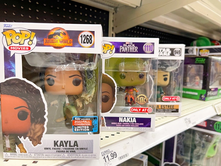 A variety of Funko Pop toys sitting on a store shelf.