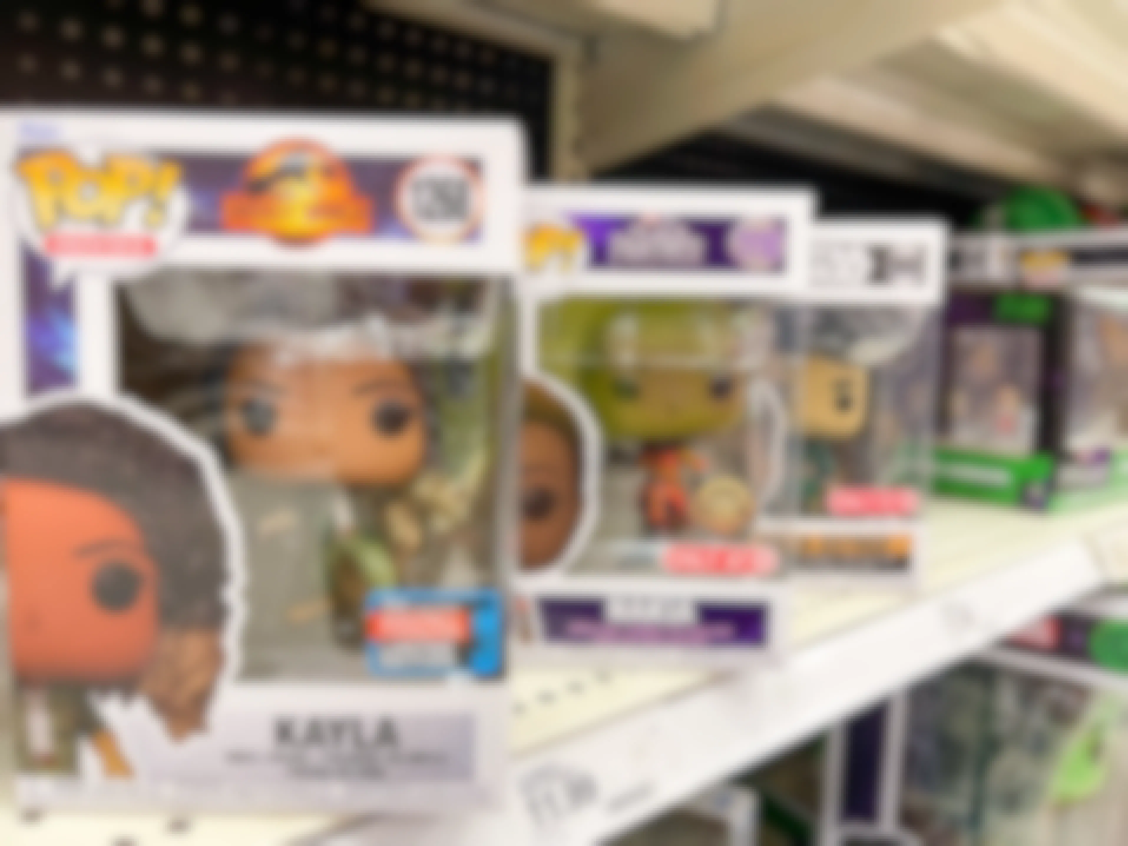 A variety of Funko Pop toys sitting on a store shelf.