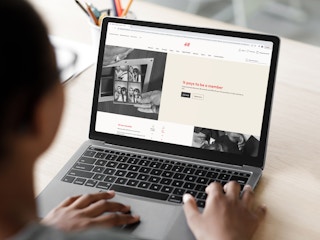 a person looking at the h&m website on their macbook
