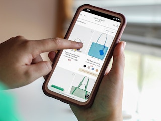 a phone with the kate spade website on it