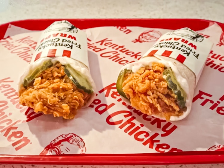 Two KFC wraps on a tray