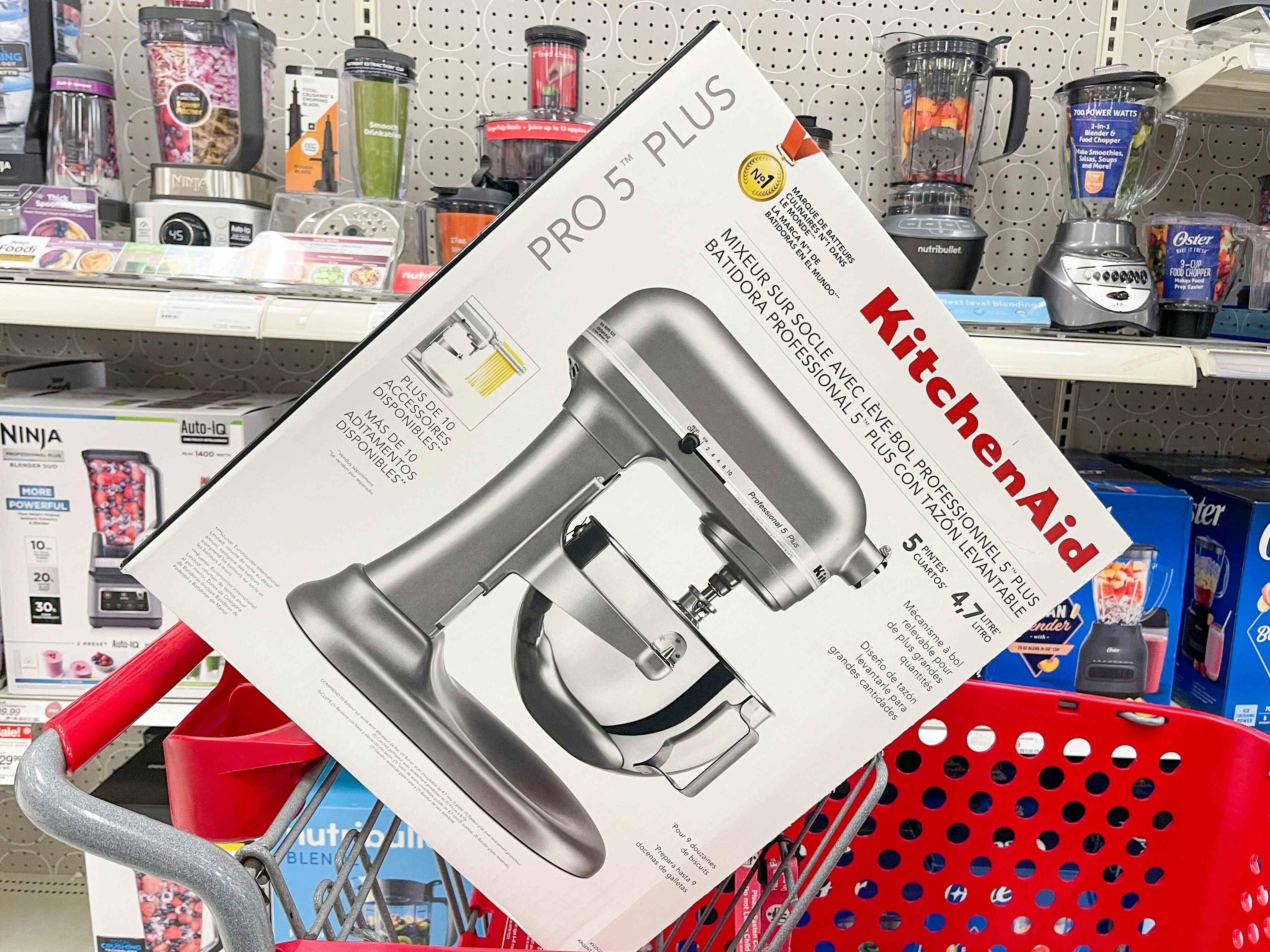 a silver professional 5-quart kitchenaid stand mixer in a red Target shopping cart