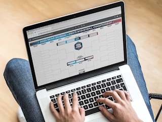 person looking at 2023 ncaa bracket on laptop screenshot