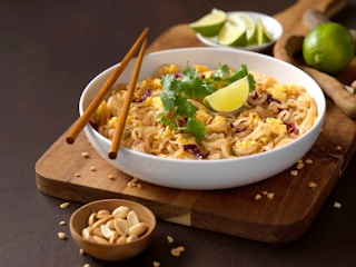 bowl of pad thai and chopsticks from noodles and company