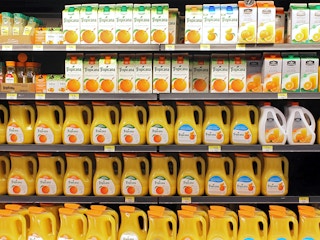 tropicana and simply orange juice bottles on store shelves