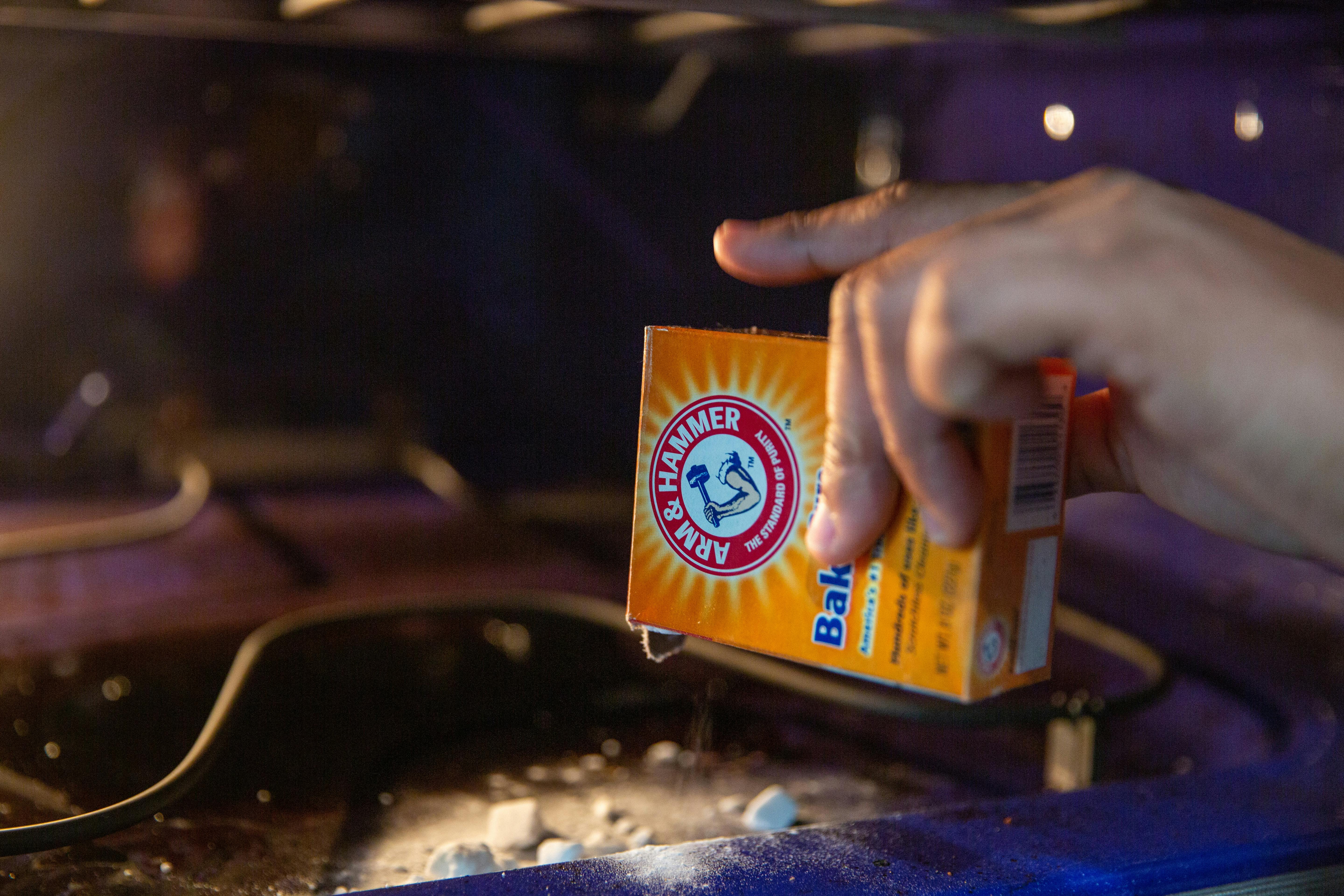 Adding "Arm & Hammer" baking soda inside the oven for a better clean