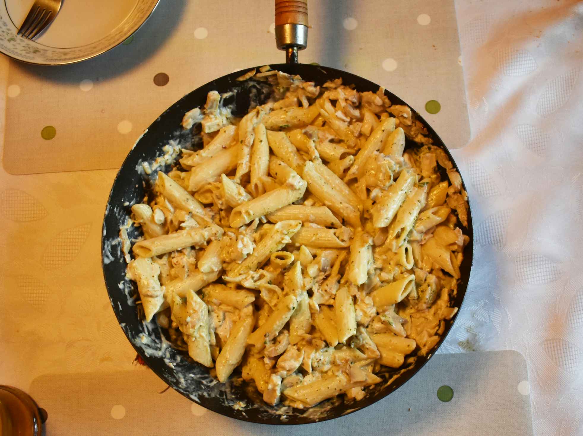 cheap meals that go a long way - Pasta in a pan on the dinner table
