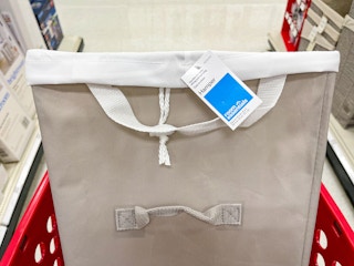 A Room essentials hamper sitting in a store cart