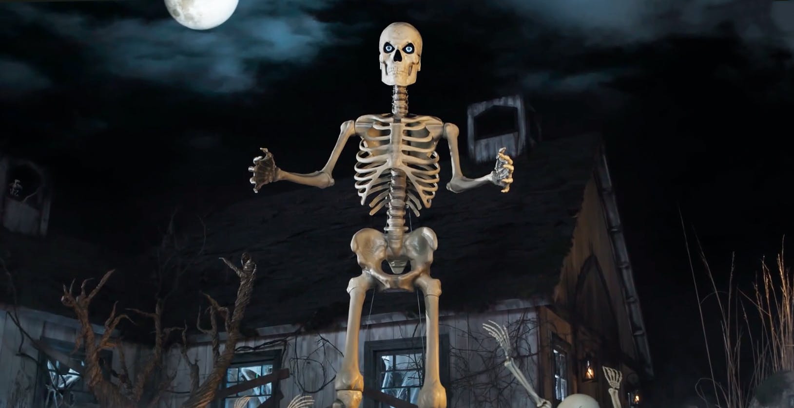 The giant skeleton from Home Depot on a spooky Halloween set