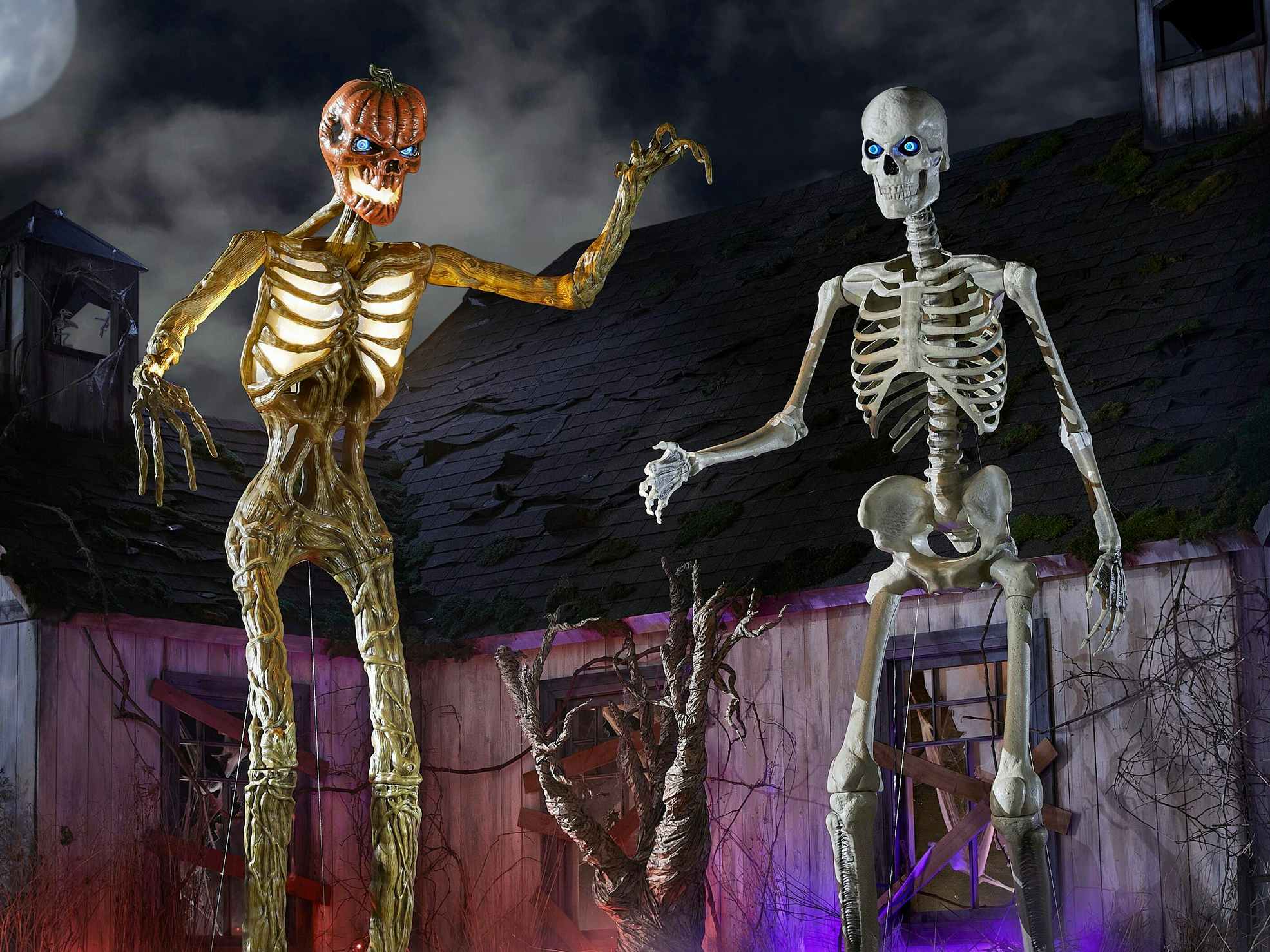 The giant skeleton decorations from Home Depot on a spooky Halloween set