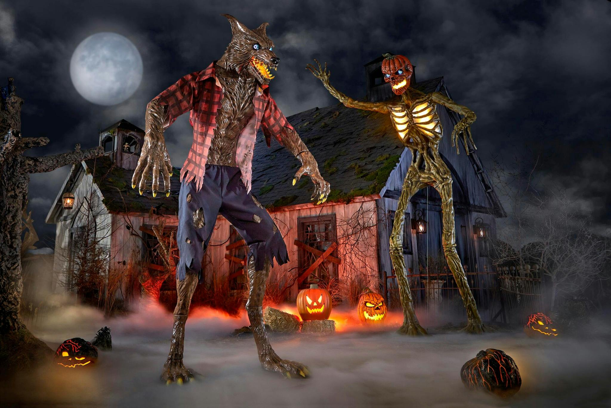 The giant inferno skeleton and immortal werewolf from Home Depot on a spooky Halloween set