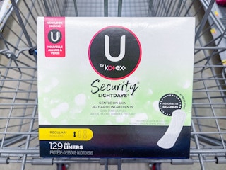 A U by Kotex Security light days liners box sitting in a store cart.