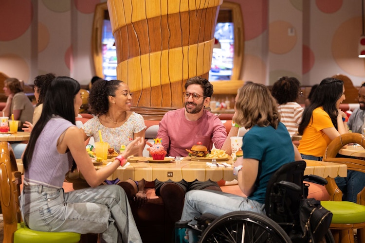 a ground of people eating at a cafe at super nintendo world at universal studios hollywood