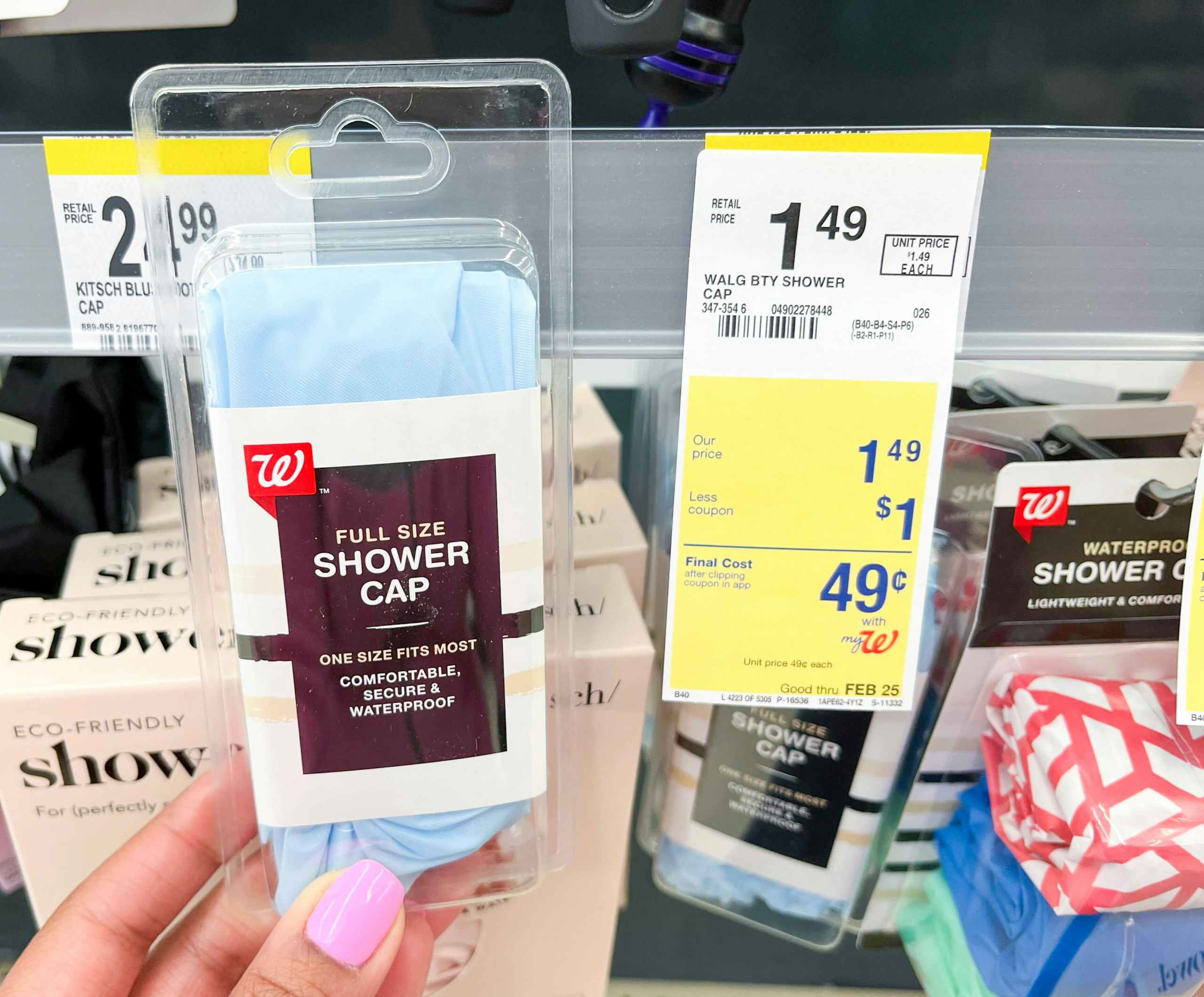 hand holding a pack of one Walgreens shower cap next to price tag