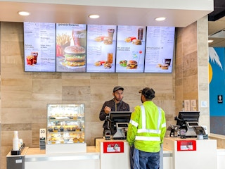 a person ordering at mcdonalds