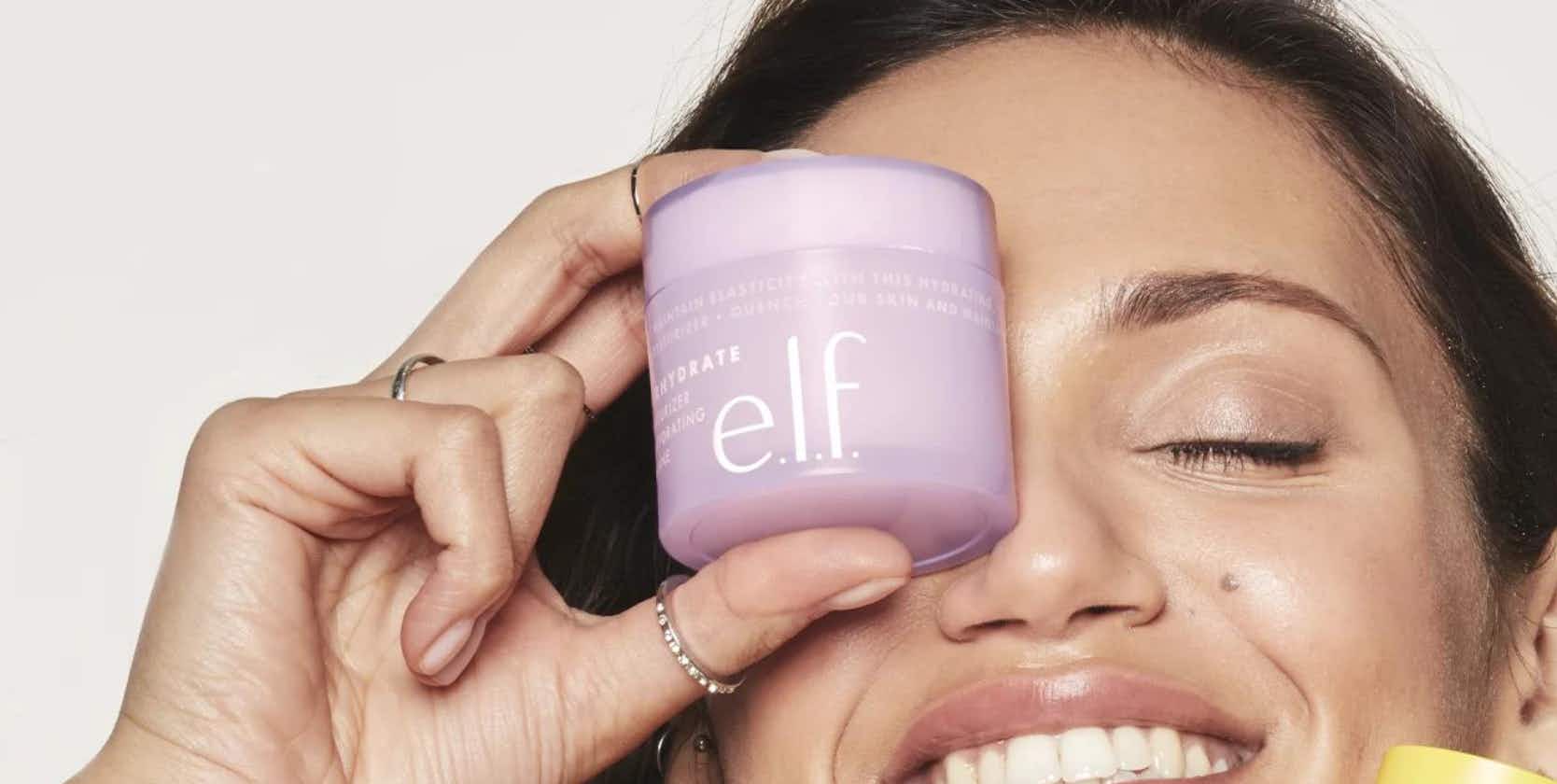 person holding a jar of e.l.f. superhydrate facial moisturizer