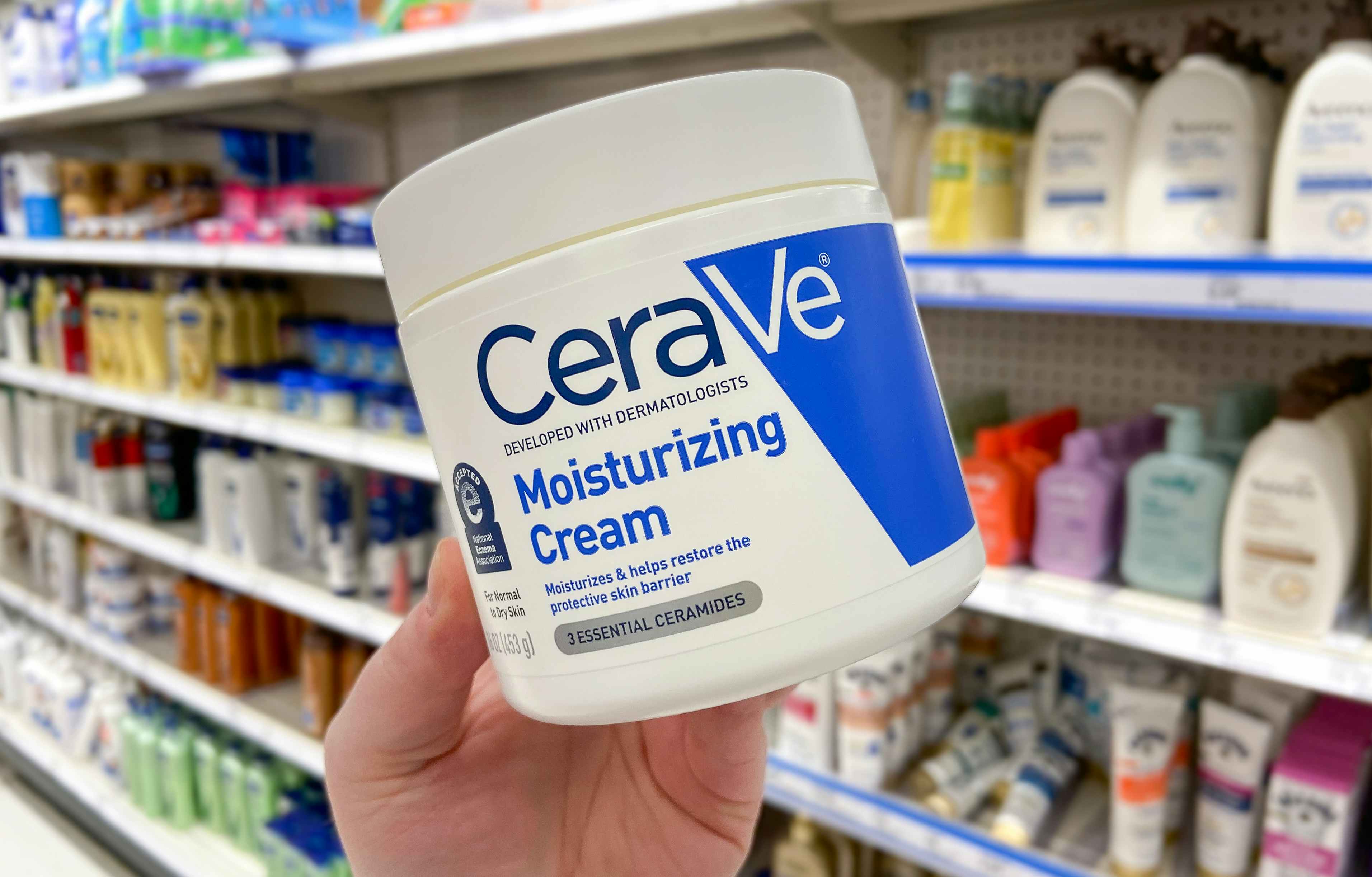 hand holding cerave moisturizing cream