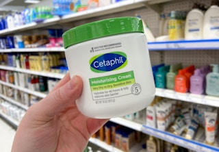 hand holding cetaphil moisturizing cream