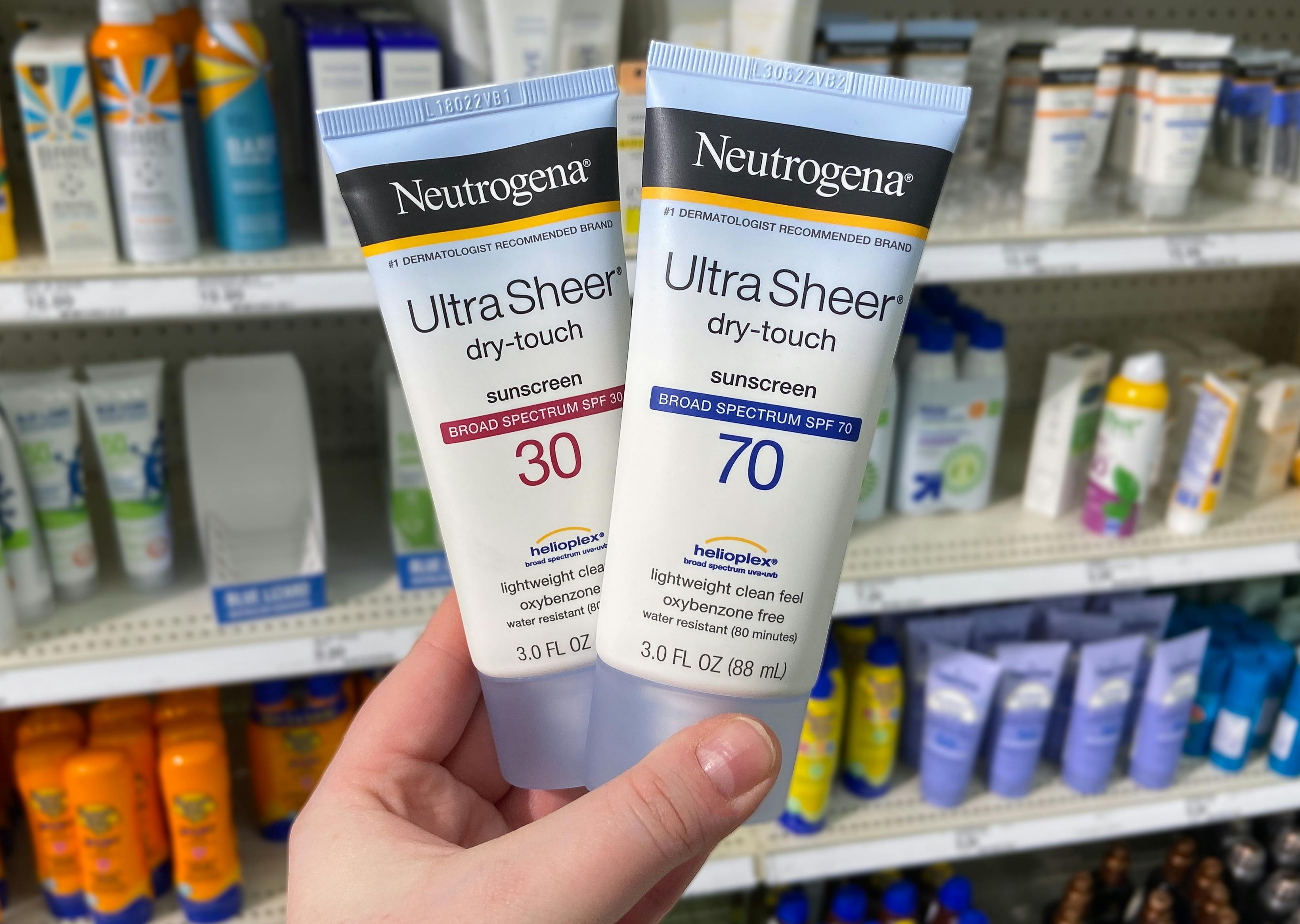 hand holding neutrogena sunscreen