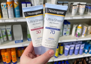 hand holding neutrogena sunscreen