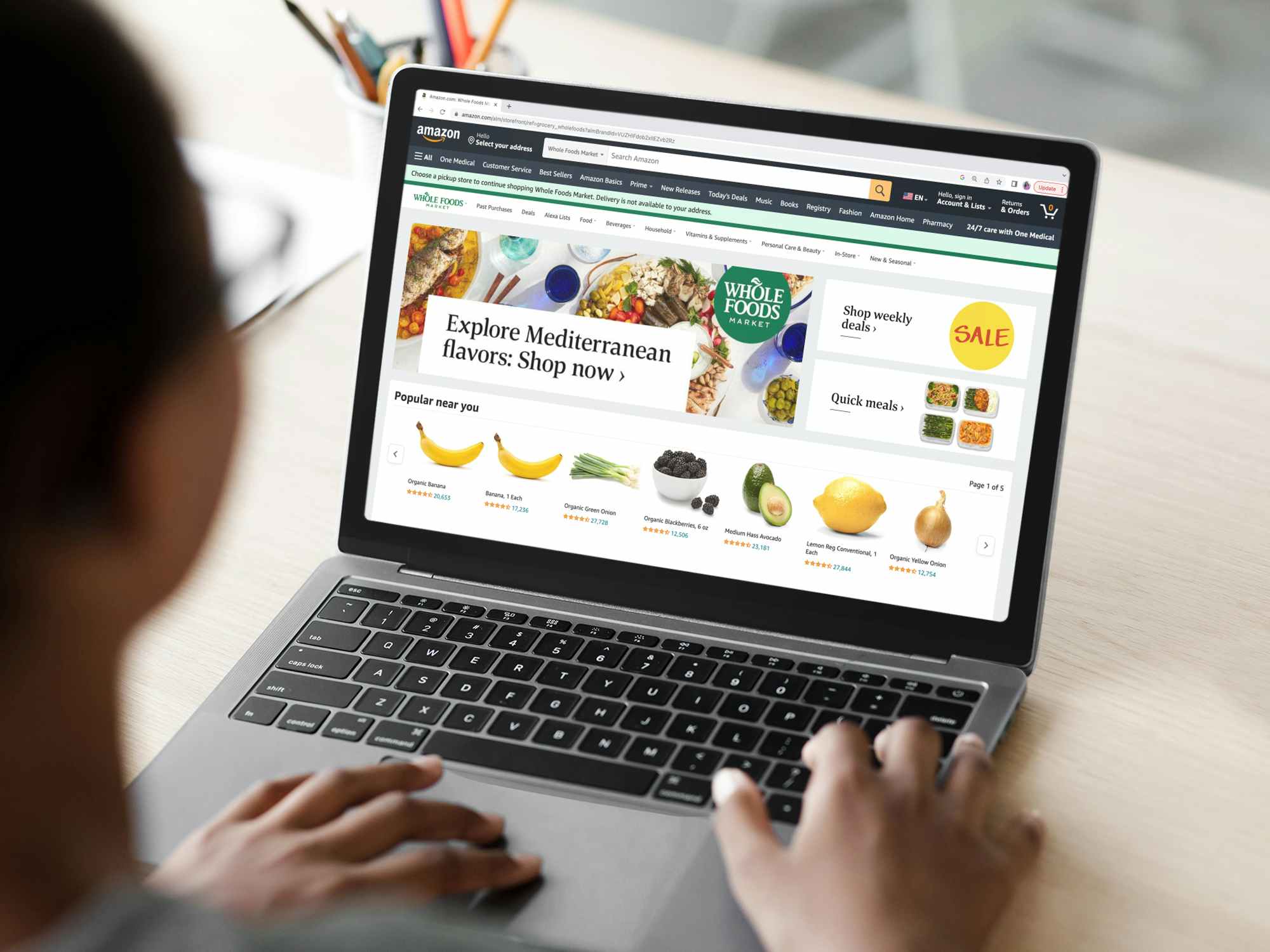 a person looking at whole food items on the amazon fresh website