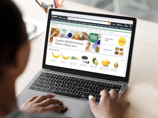 a person looking at whole food items on the amazon fresh website