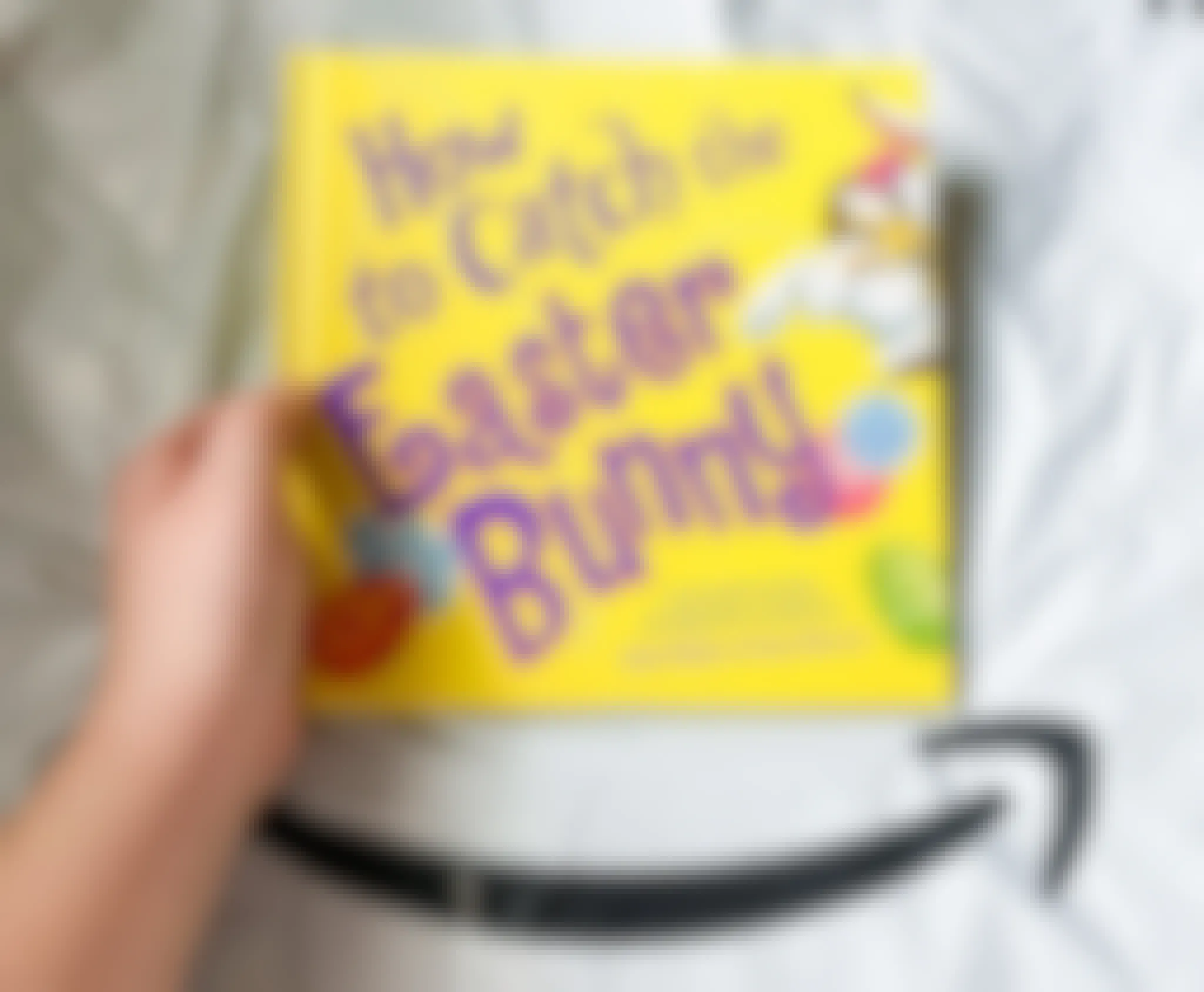 A How to Catch the Easter Bunny children's book on top of an amazon shipping package