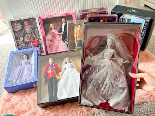 person holding zombie bride barbie with other rare dolls
