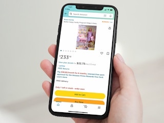 person holding iphone showing barbie happy family pregnant midge and baby doll for sale