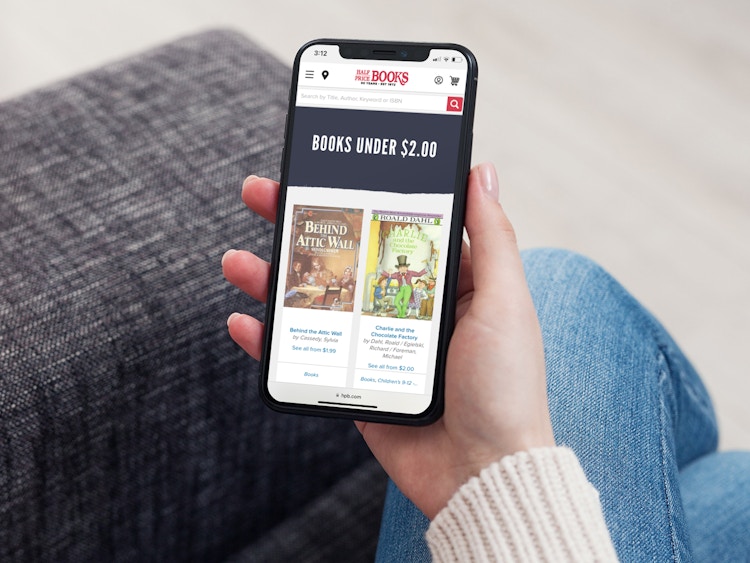a person looking at the half price books website on their iphone