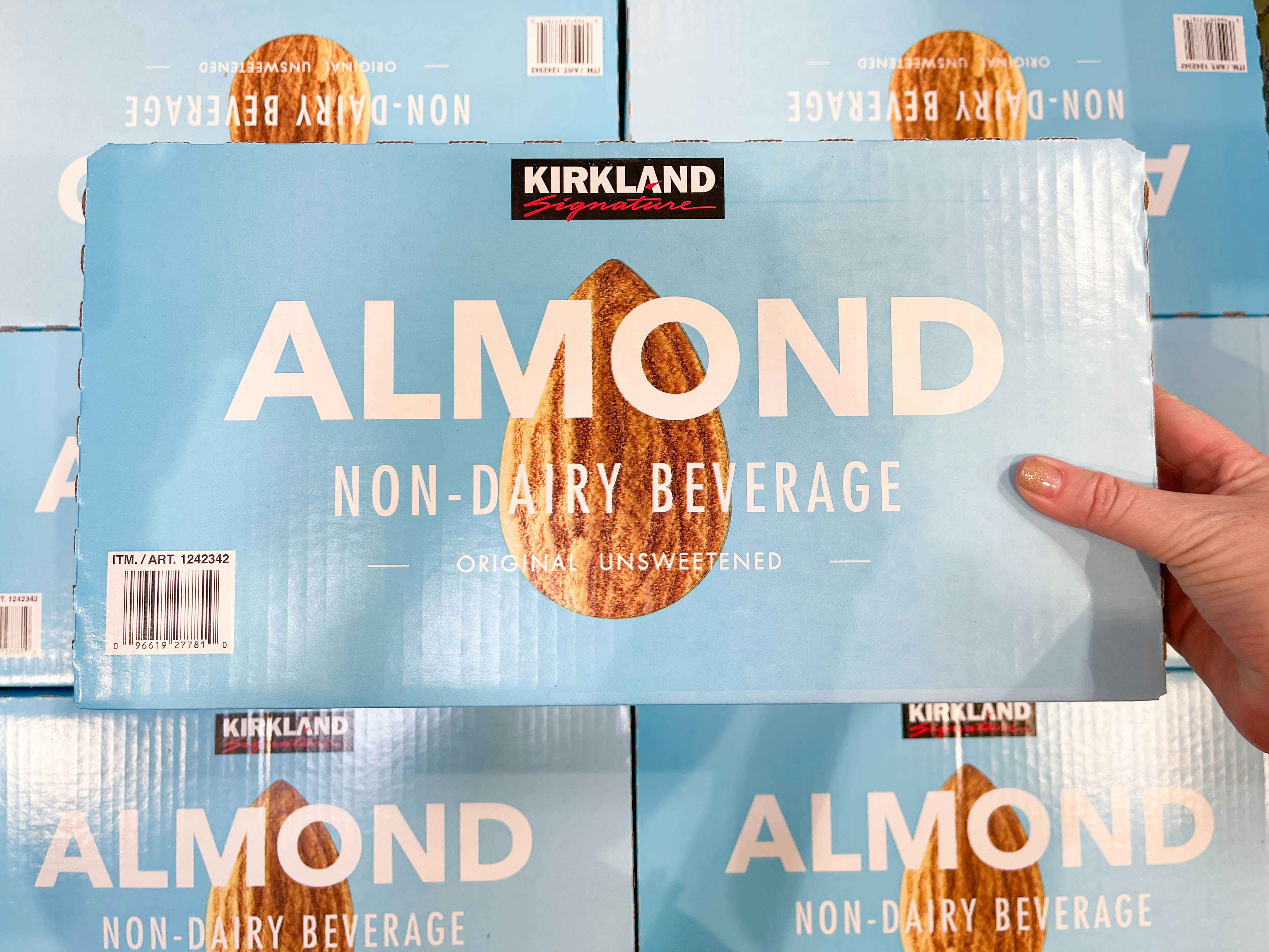 a box of almond milk being held in store