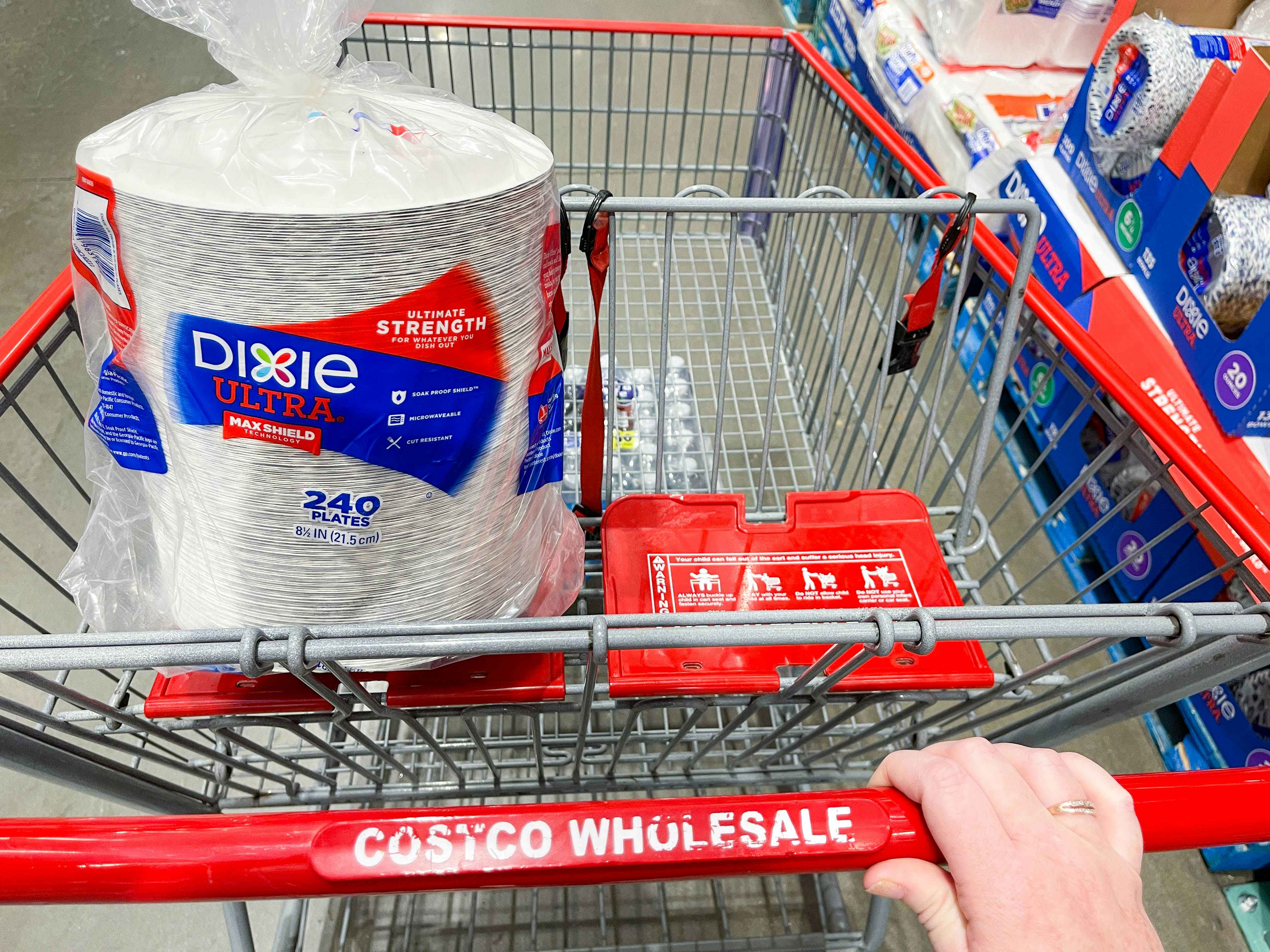 a package of paper plates in a costco cart