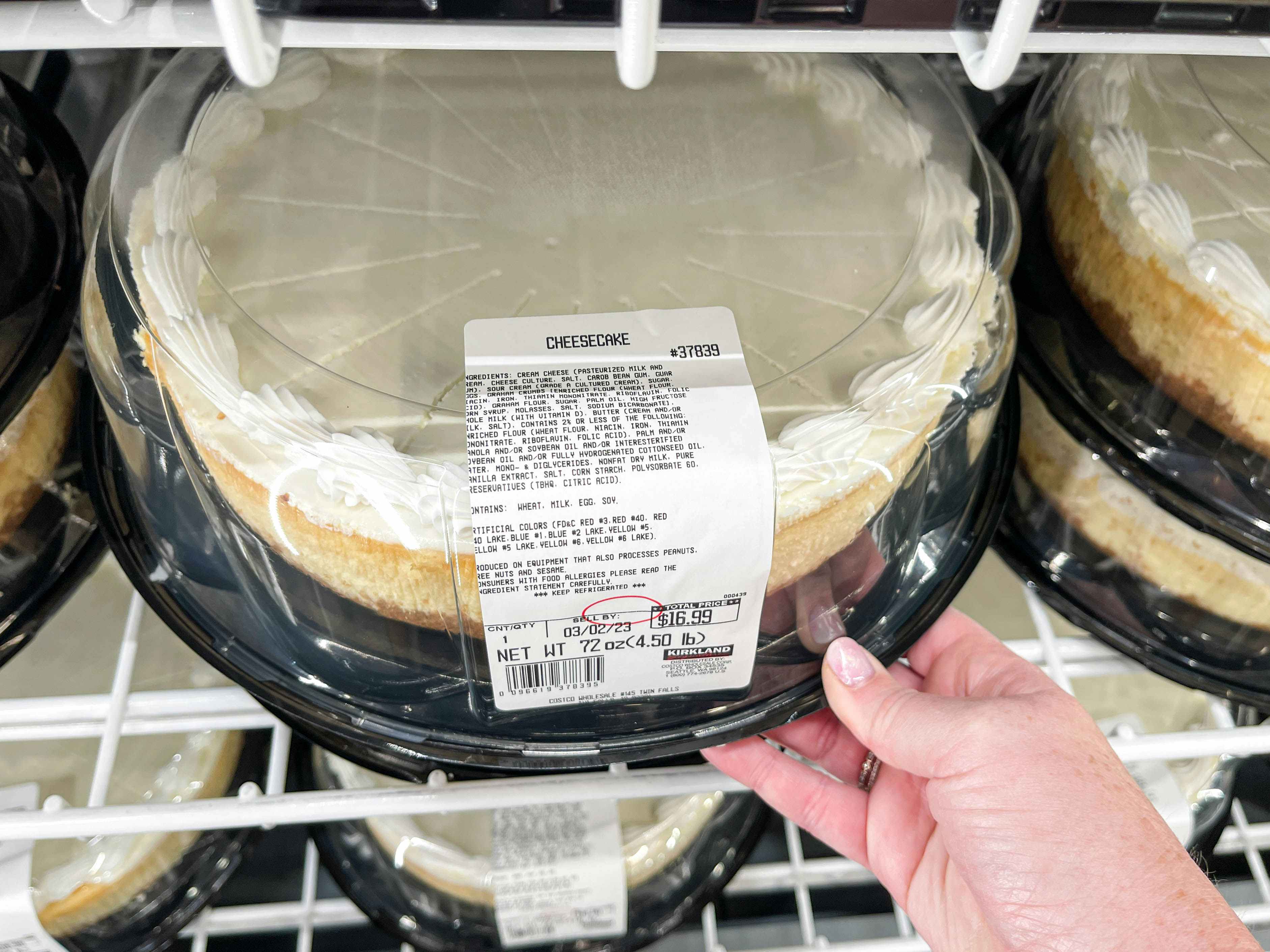 a costco cheese cake being grabbed in store 