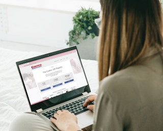 a person looking at costco gift registry on laptop