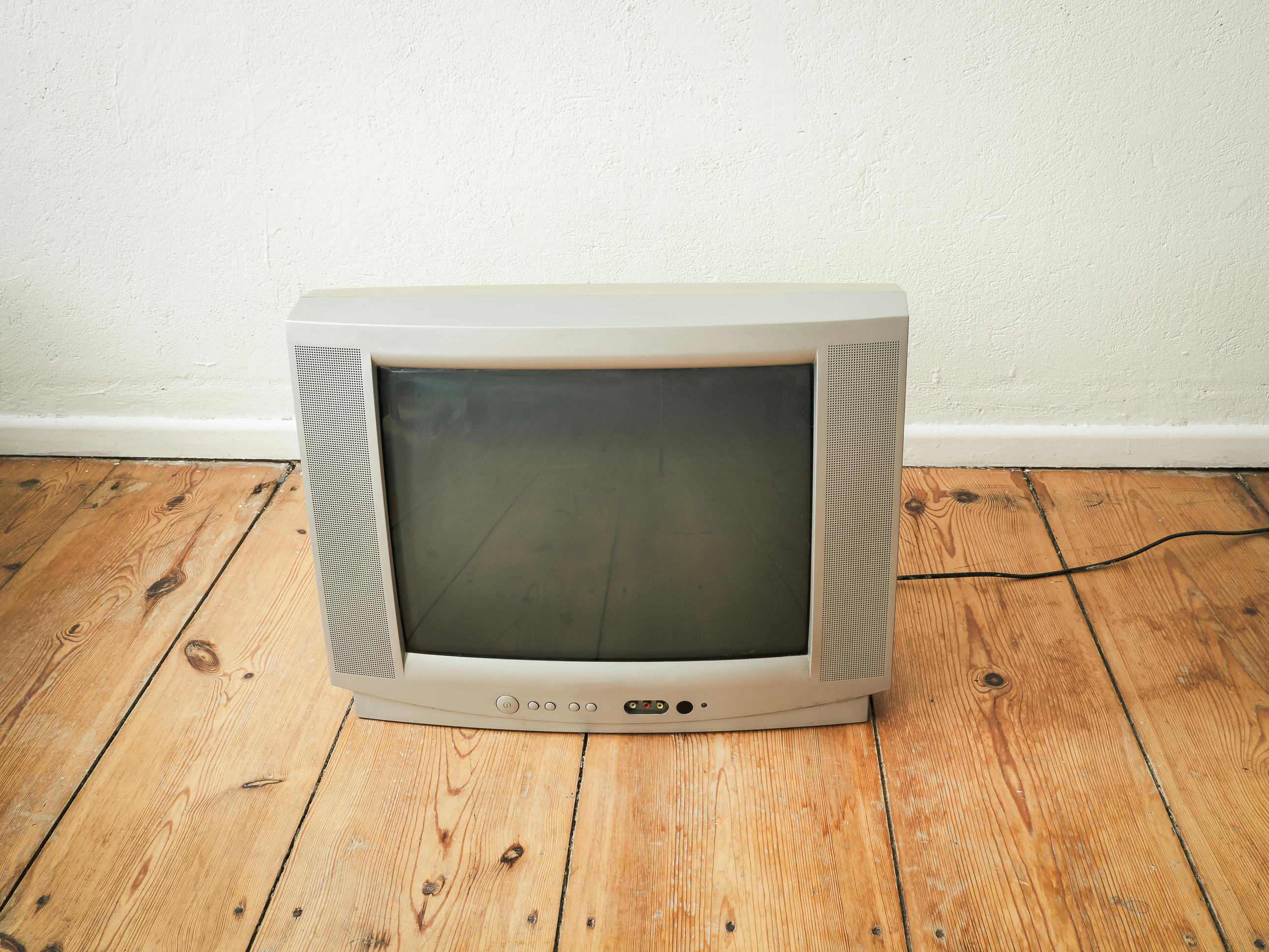 CRT TV on a wooden floor