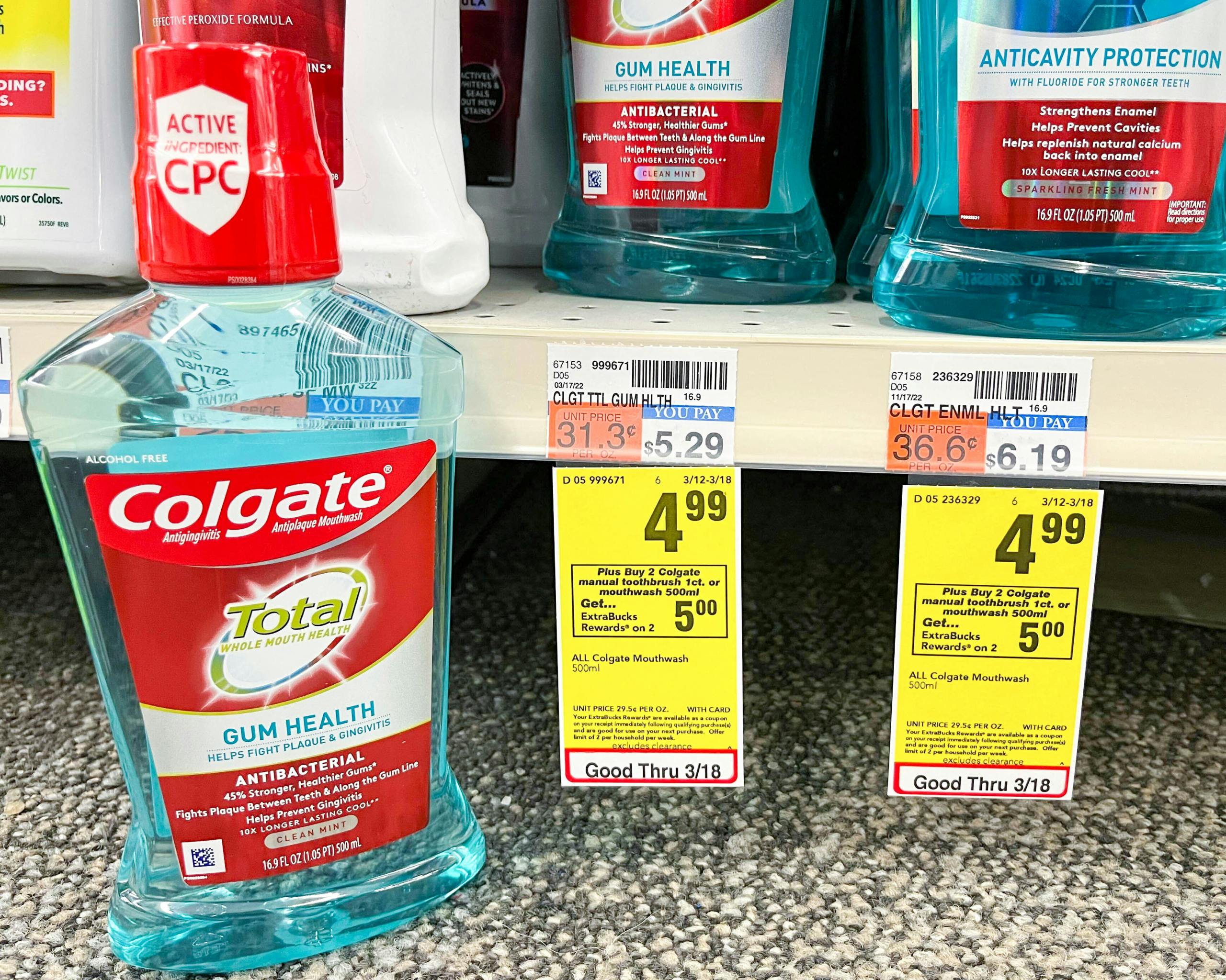 bottle of Colgate mouthwash next to sales tag