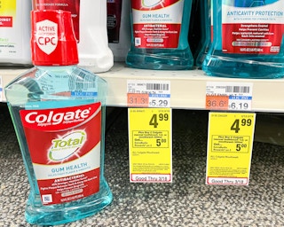 bottle of Colgate mouthwash next to sales tag