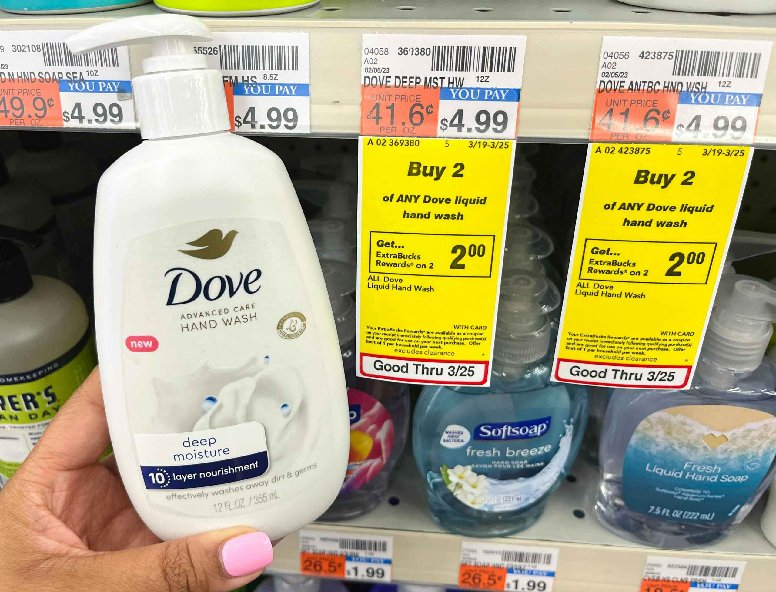 hand holding bottle of Dove advanced care hand wash next to sales tag