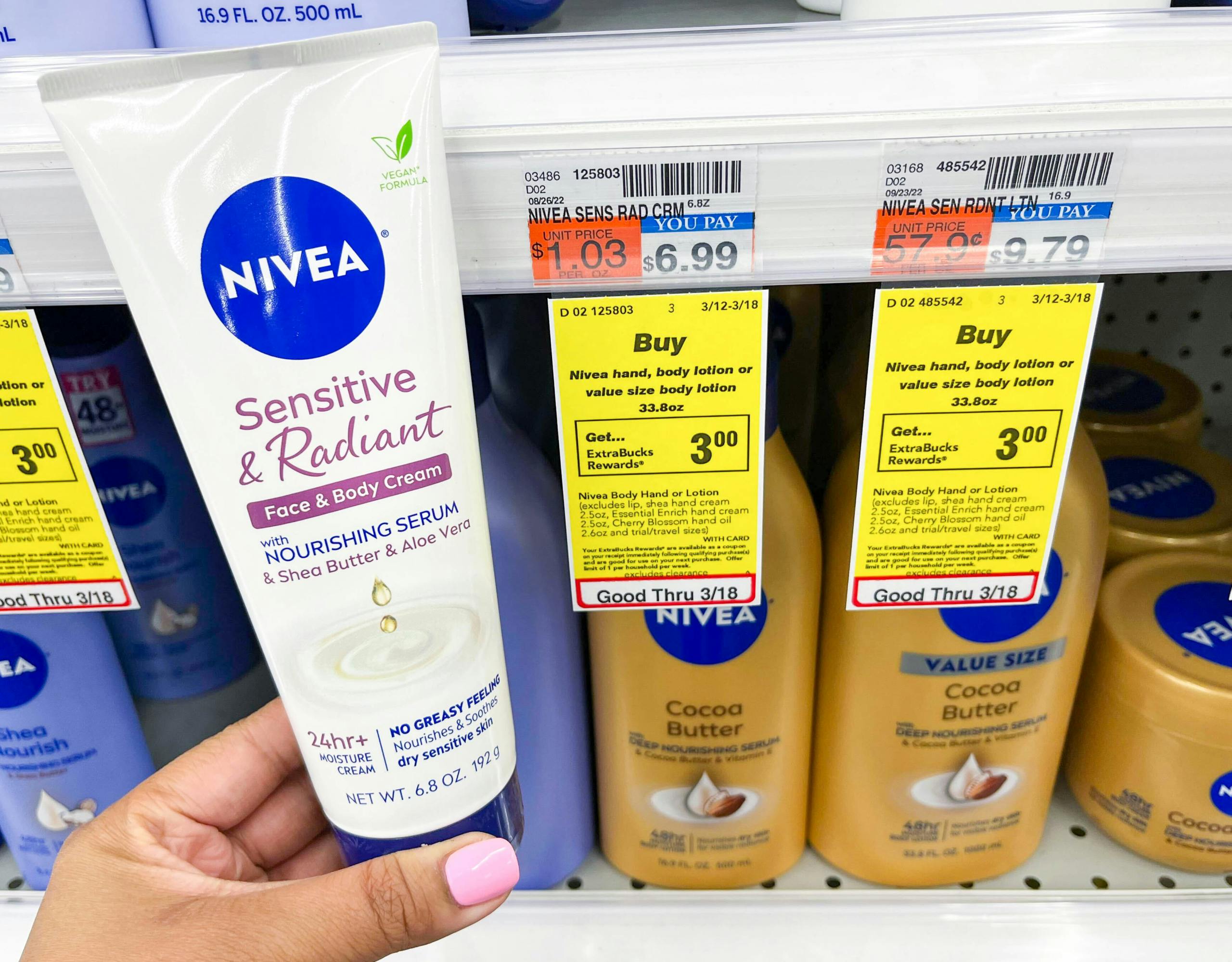 hand holding bottle of Nivea cream next to sales tag