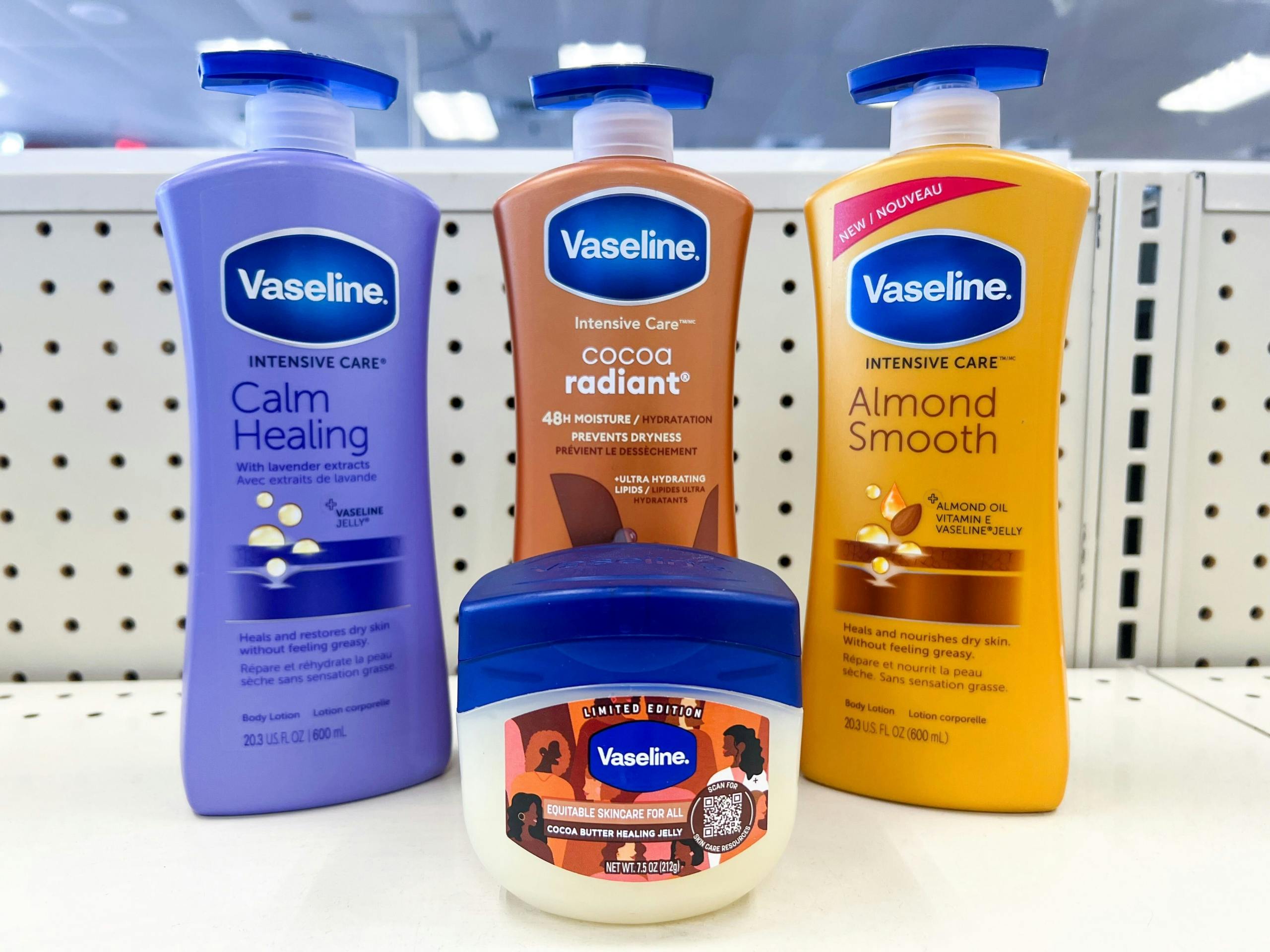 bottle of Vaseline next to three bottles of Vaseline lotions on shelf