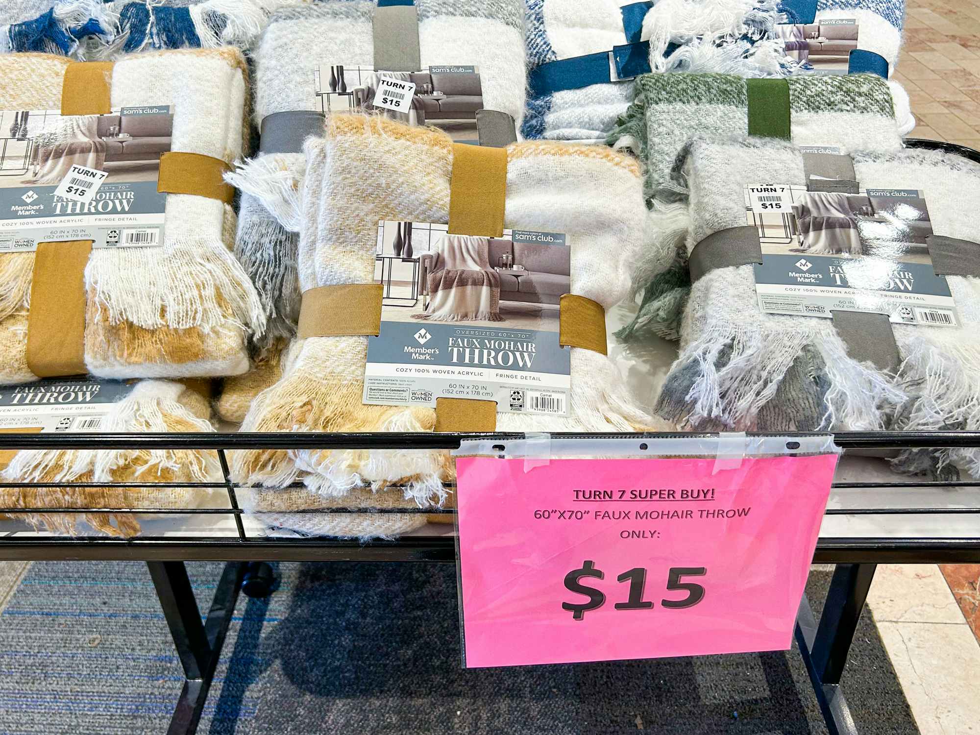 Some Member's Mark faux mohair throw blankets priced at $15 in a Turn7 store