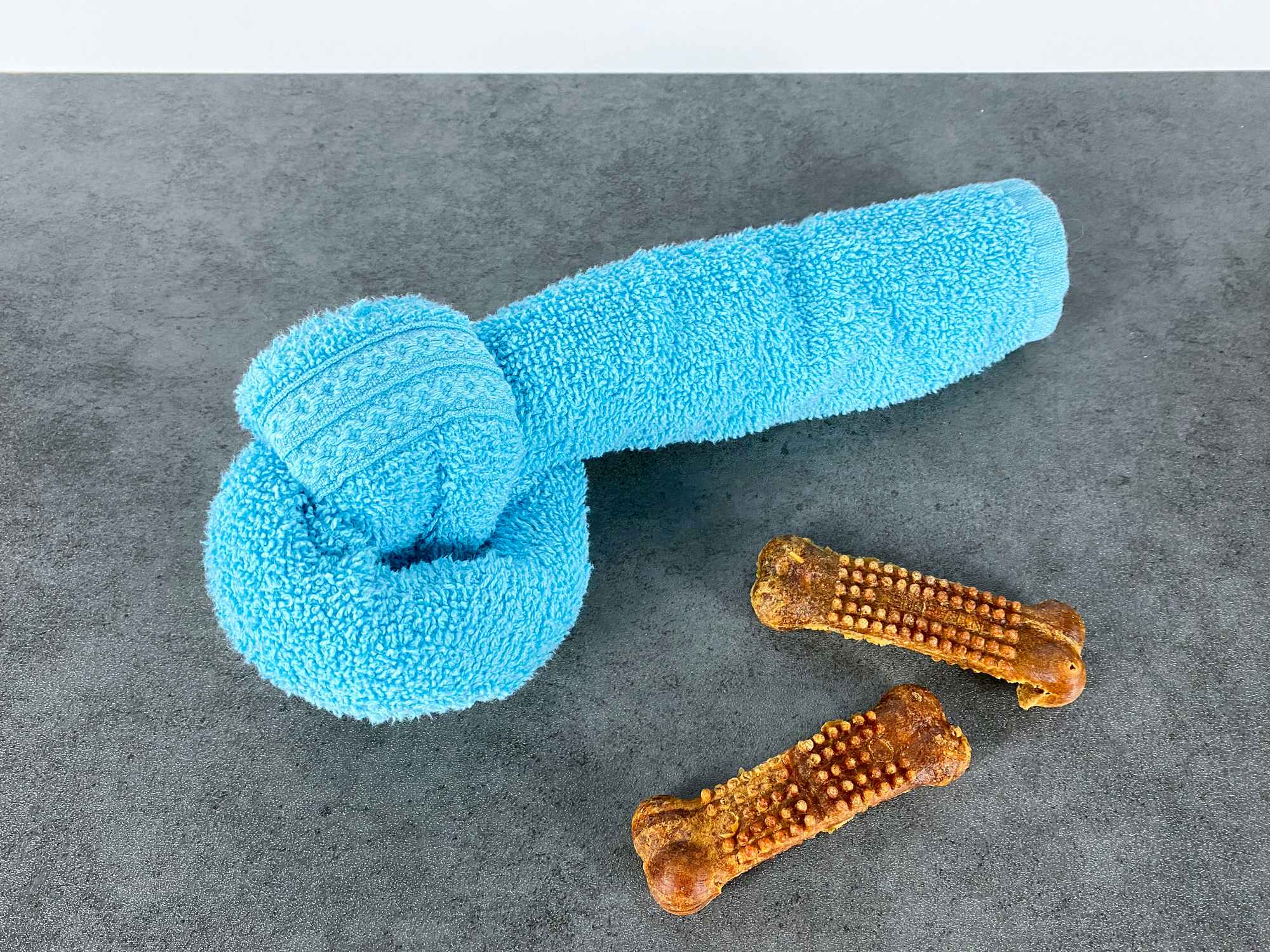 diy dog toy with knotted towel and treats