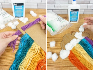 Someone pulling yarn through a hole in a cardboard cloud to make the purple stripe of a rainbow, and gluing cotton balls onto the cardboard for the cloud