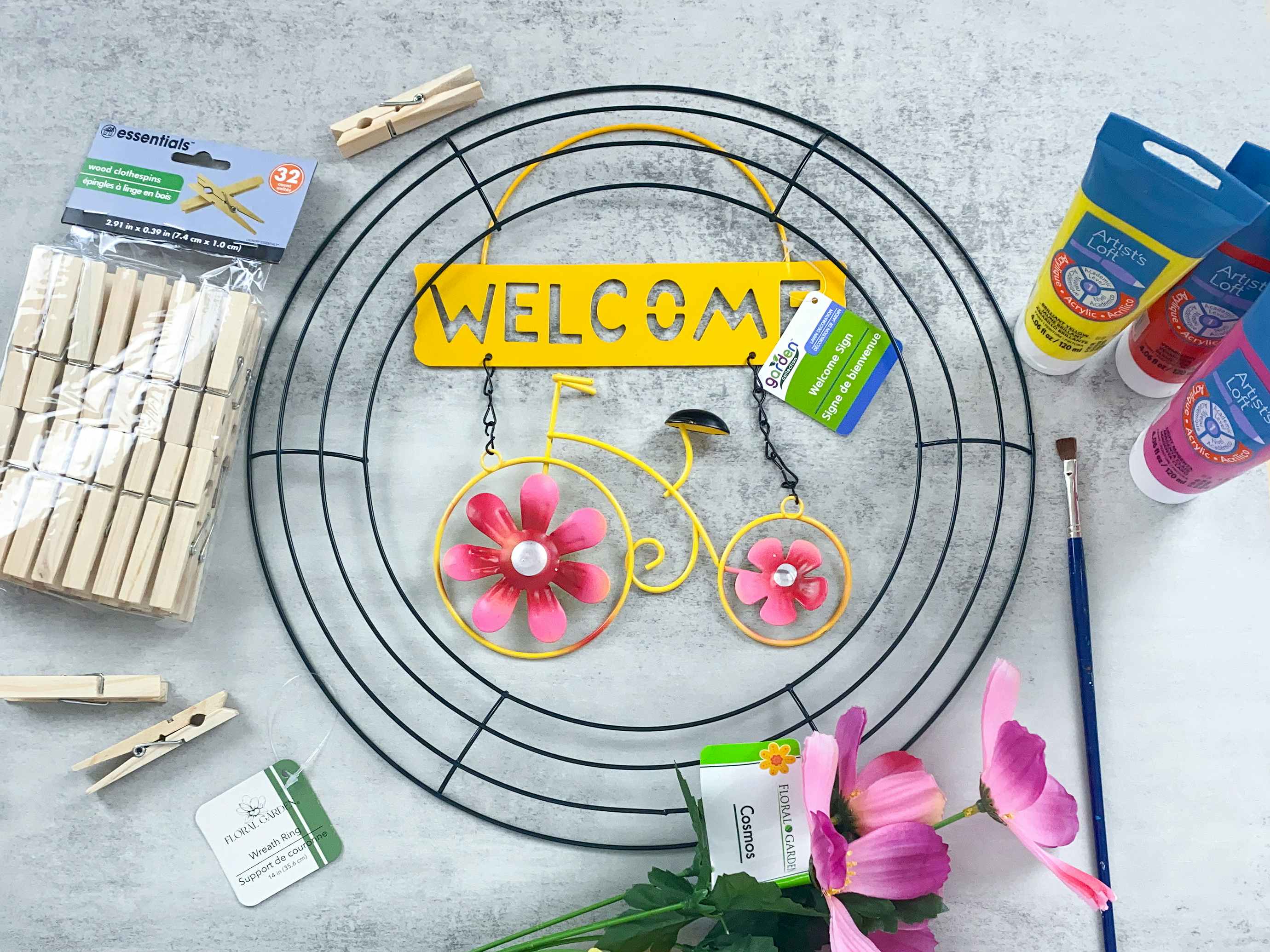 bright spring wreath with dollar tree garden sign and painted clothespins