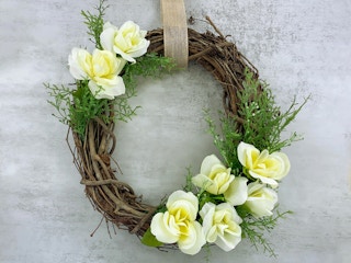 finished spring wreath made with dollar tree artificial roses and foliage